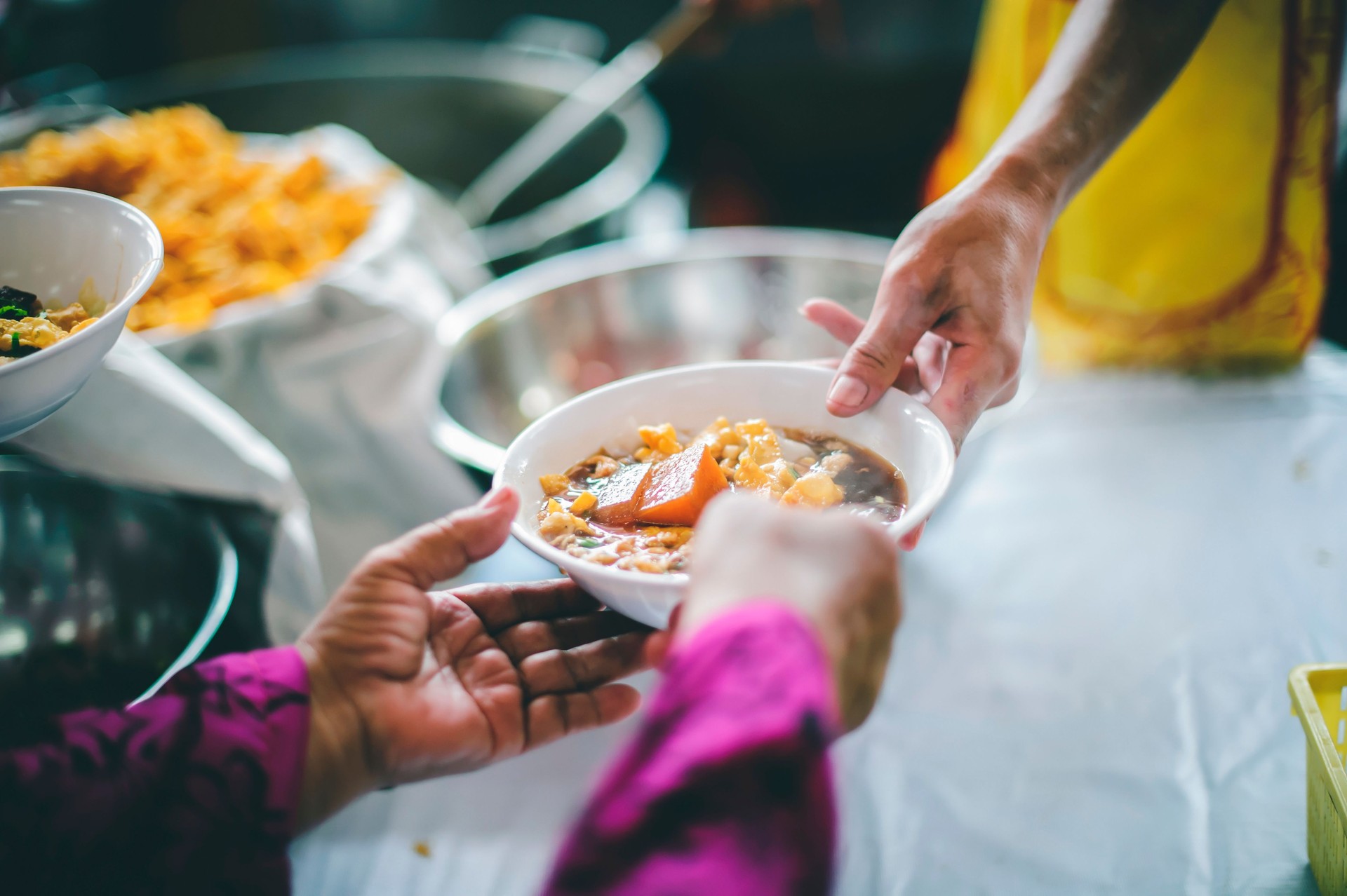 Giving free food to the homeless. Volunteers feed ChiangMai's hungry and homeless meal