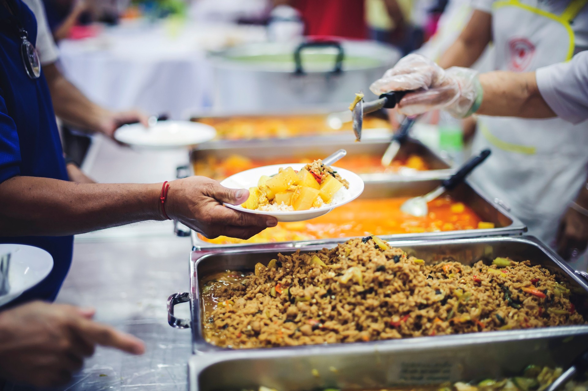 Feeding the poor to hands of a beggar, feeding food for beggar poverty concept